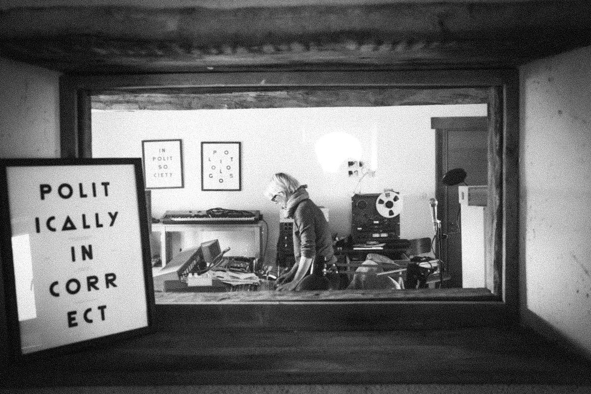 Pamela Hute at work, seen through the control room window